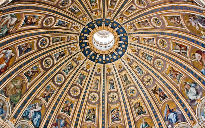 St. Peter's Basilica dome interior with intricate frescoes and gold detailing, Vatican City.