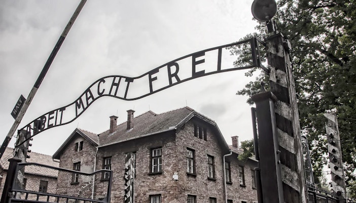 Auschwitz I main entrance gate with "Arbeit Macht Frei" sign, Poland.