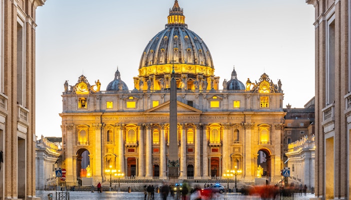 St. Peter's Basilica at dusk, Vatican City, highlighting evening tour timings.