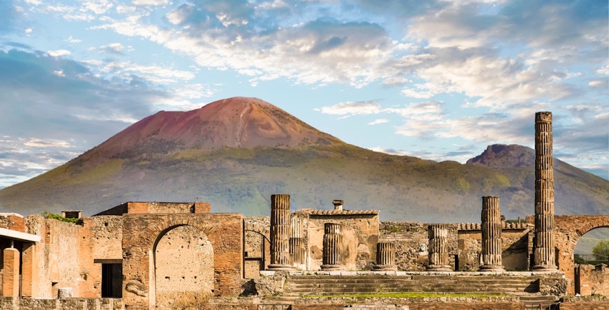 Ancient ruins of Pompeii with Mount Vesuvius in the background, Naples to Pompeii tour.