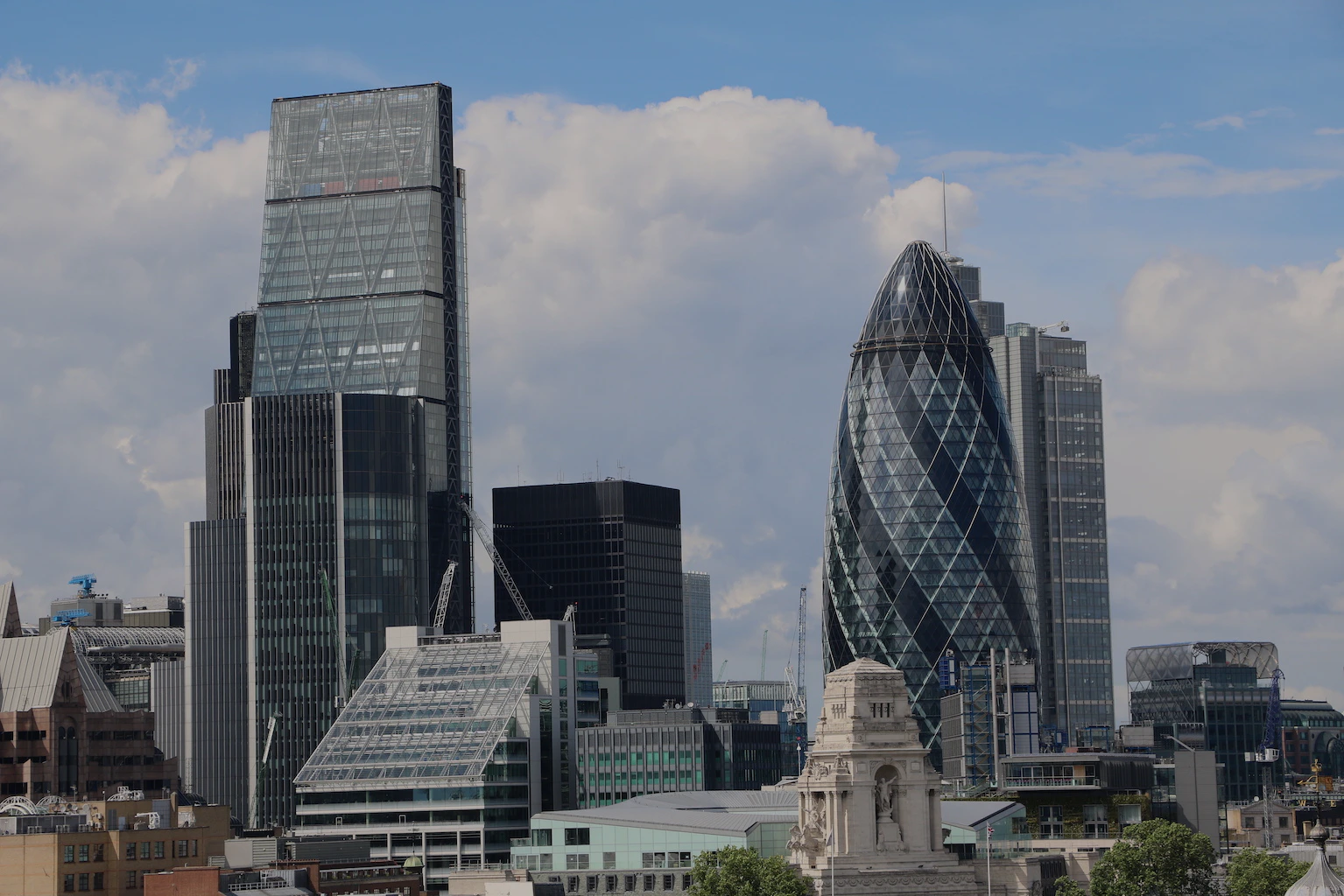 Skyline view of The Gherkin and surrounding skyscrapers in London.