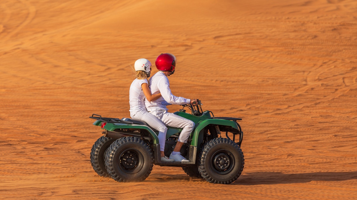 A couple on a Quad bike in Dubai