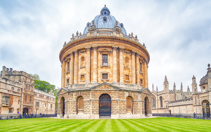 Radcliffe Camera at Oxford University, England, with surrounding historic architecture.