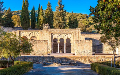 Medina Azahara ruins with arches and trees in Cordoba, Spain.