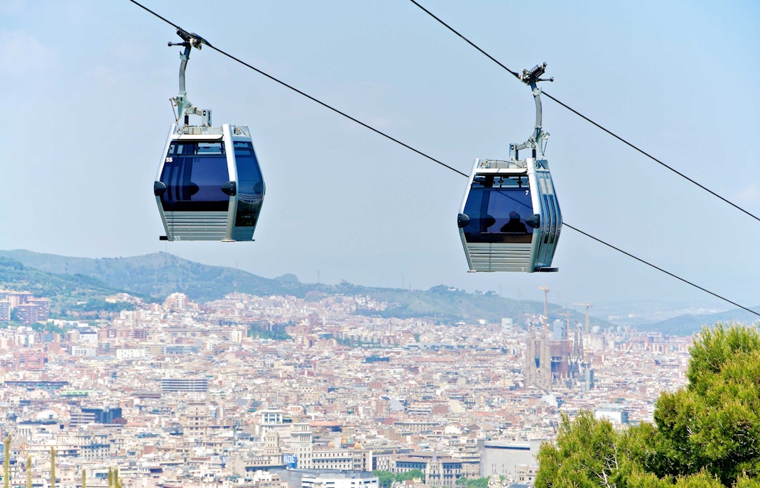 Barcelona cable car ride with kids offering panoramic city views.