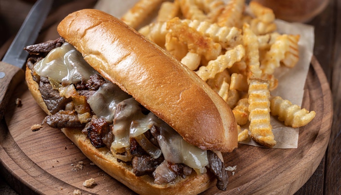 hot dog with a side of fries at a restaurant