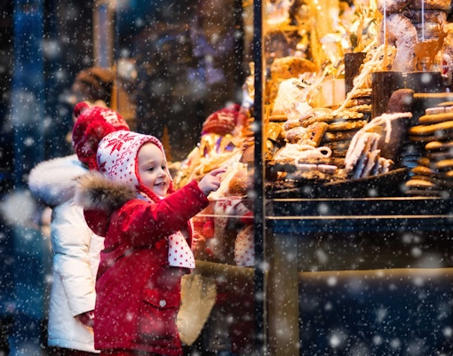 Child admiring holiday treats