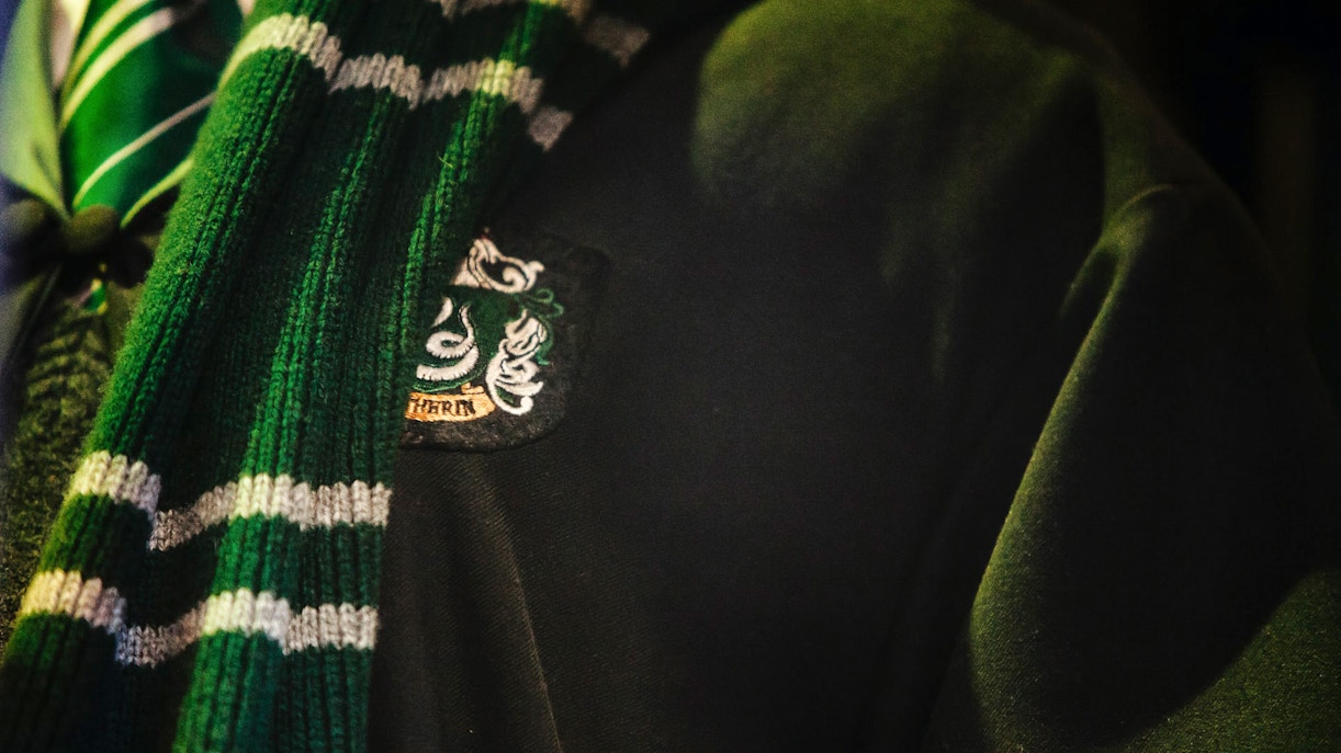 Slytherin scarf and robe detail at Harry Potter Studio Shop.