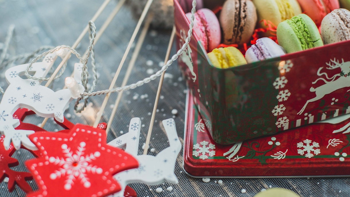 Box of colorful macarons with Christmas decorations in Paris.