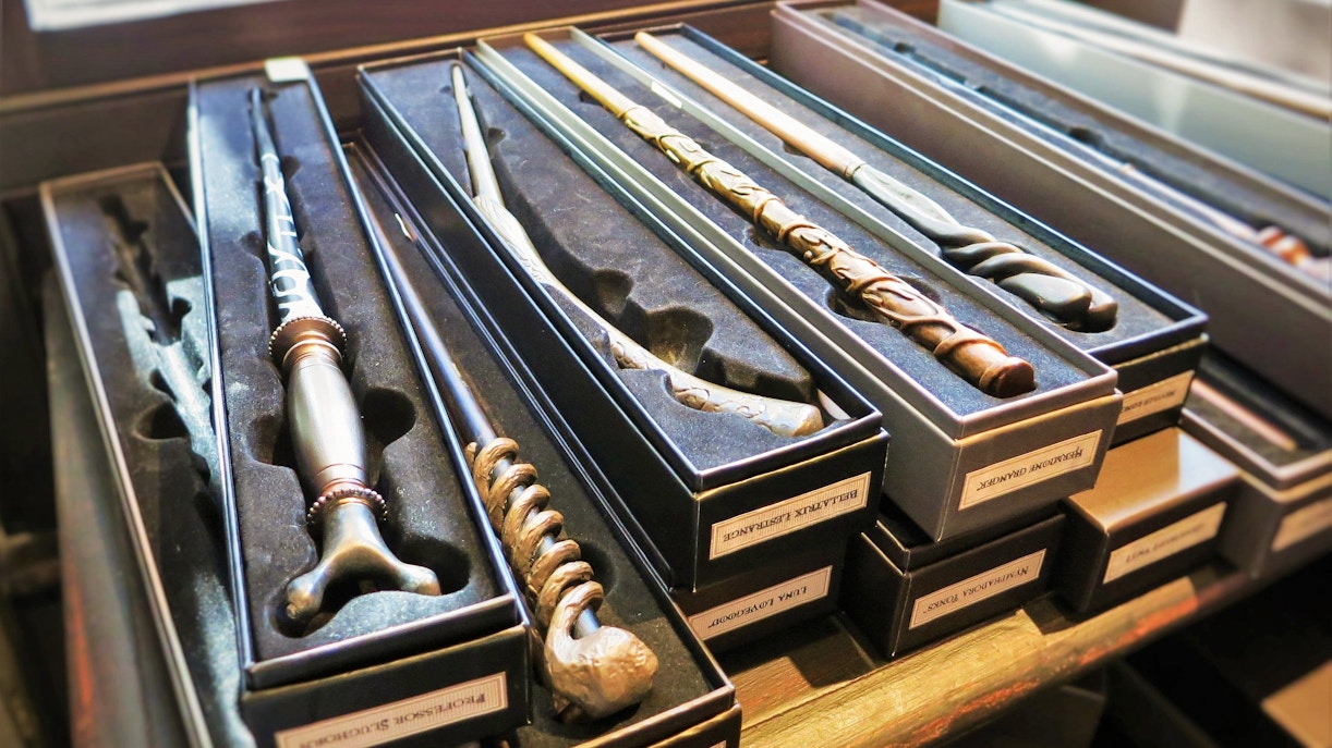 Harry Potter Studio Shop merchandise display with wands and themed souvenirs.