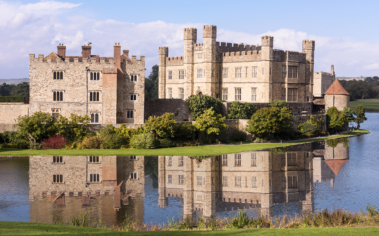 Leeds Castle with reflection in the surrounding moat, Kent, England.