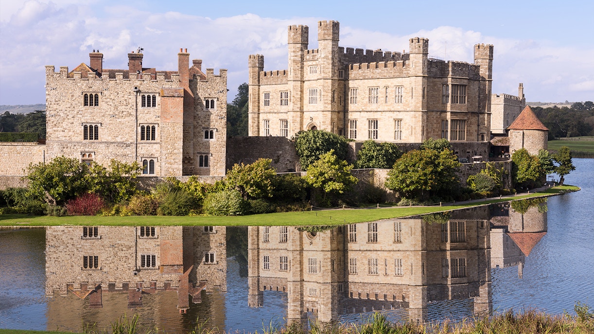 Leeds Castle with reflection in the surrounding moat, Kent, England.