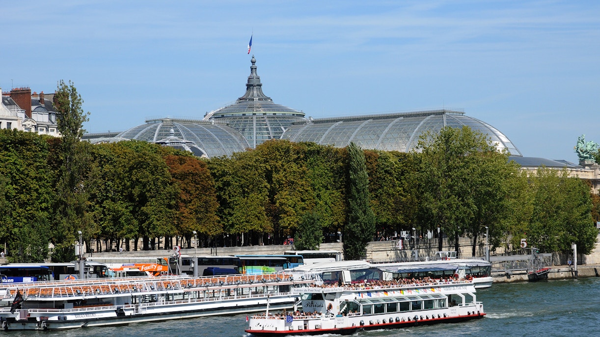 Seine River cruise with Bateaux Mouches, Paris landmarks in view.