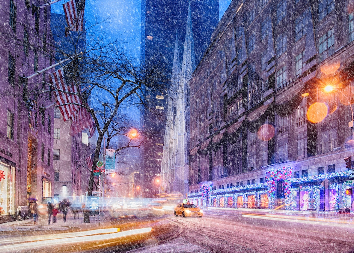 Snowy Fifth Avenue with St. Patrick's Cathedral, New York City, during Christmas.