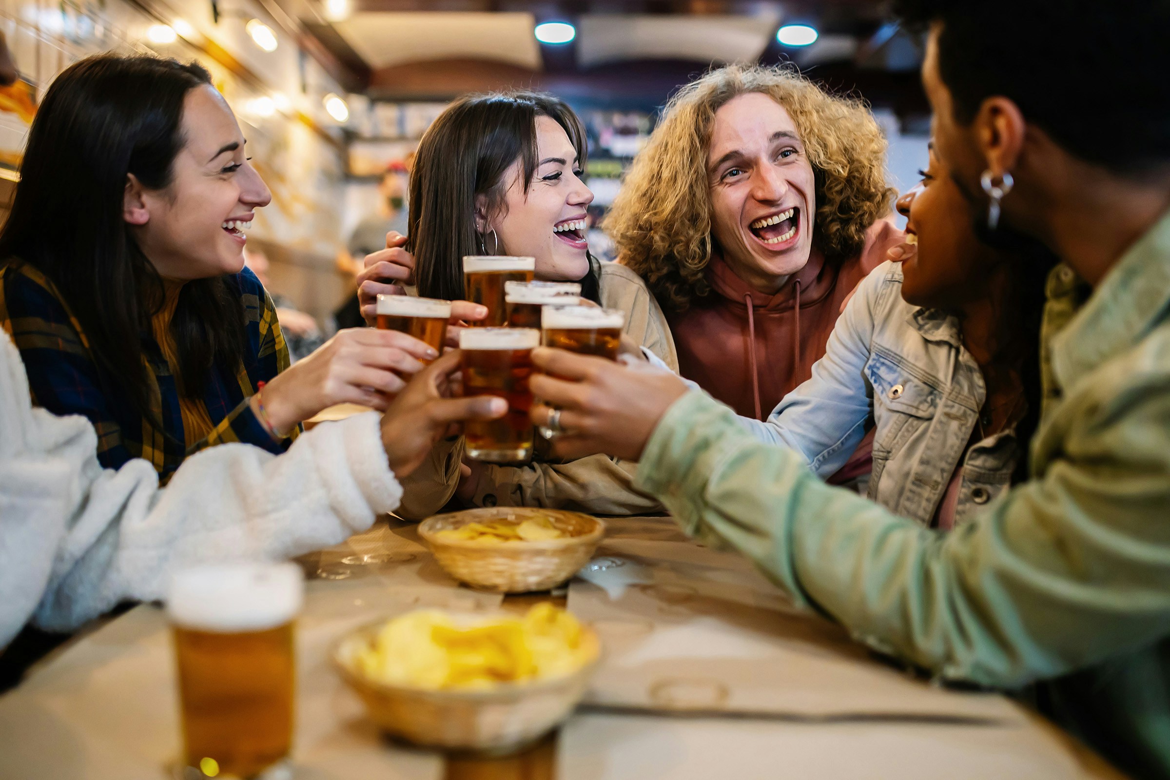 Friends enjoying drinks at a bar in Barcelona.