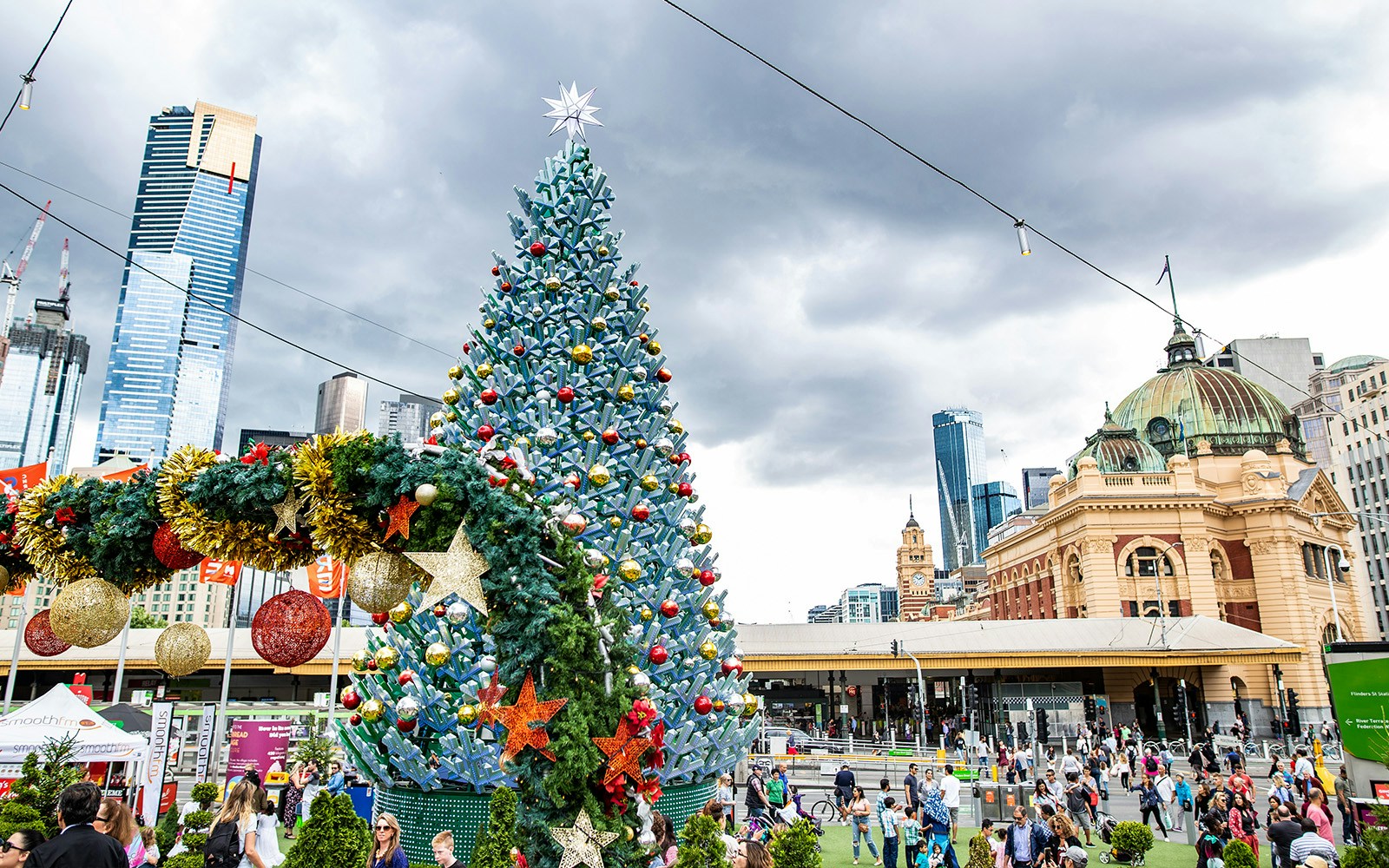 Christmas tree at Federation Square, Melbourne with Flinders Street Station in the background.