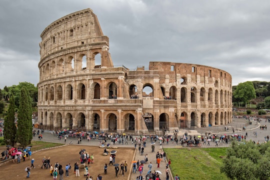 Crowds gather at the Colosseum entrance in Rome, Italy.
