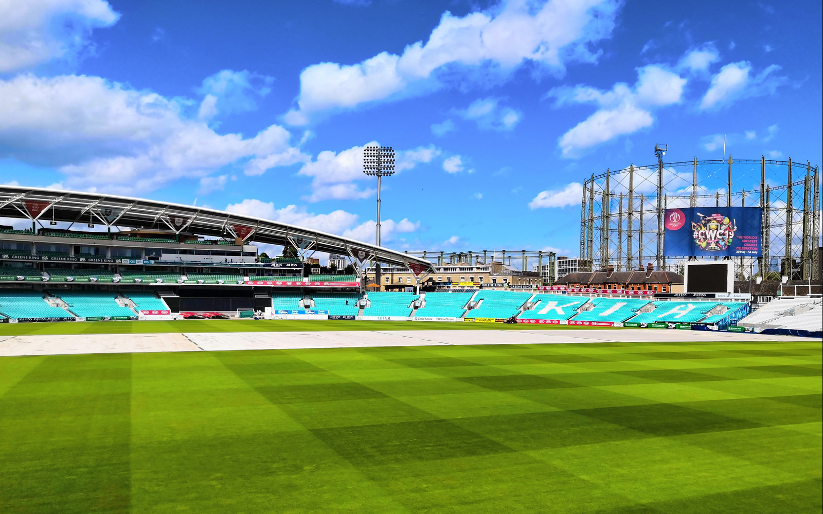Kia Oval Cricket Ground tour showcasing historic pavilion and lush green pitch in London.