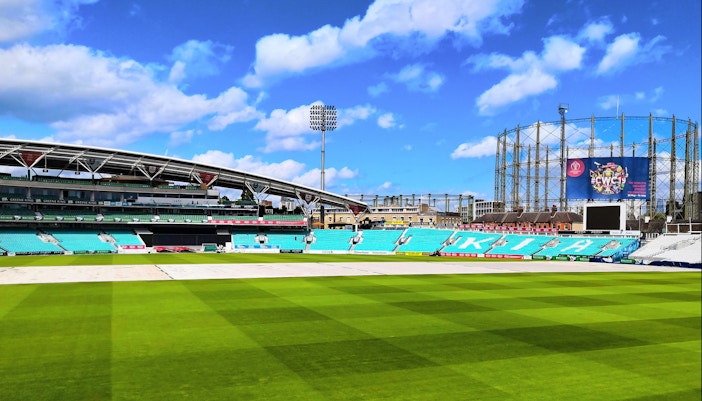 Kia Oval Cricket Ground tour showcasing historic pavilion and lush green pitch in London.