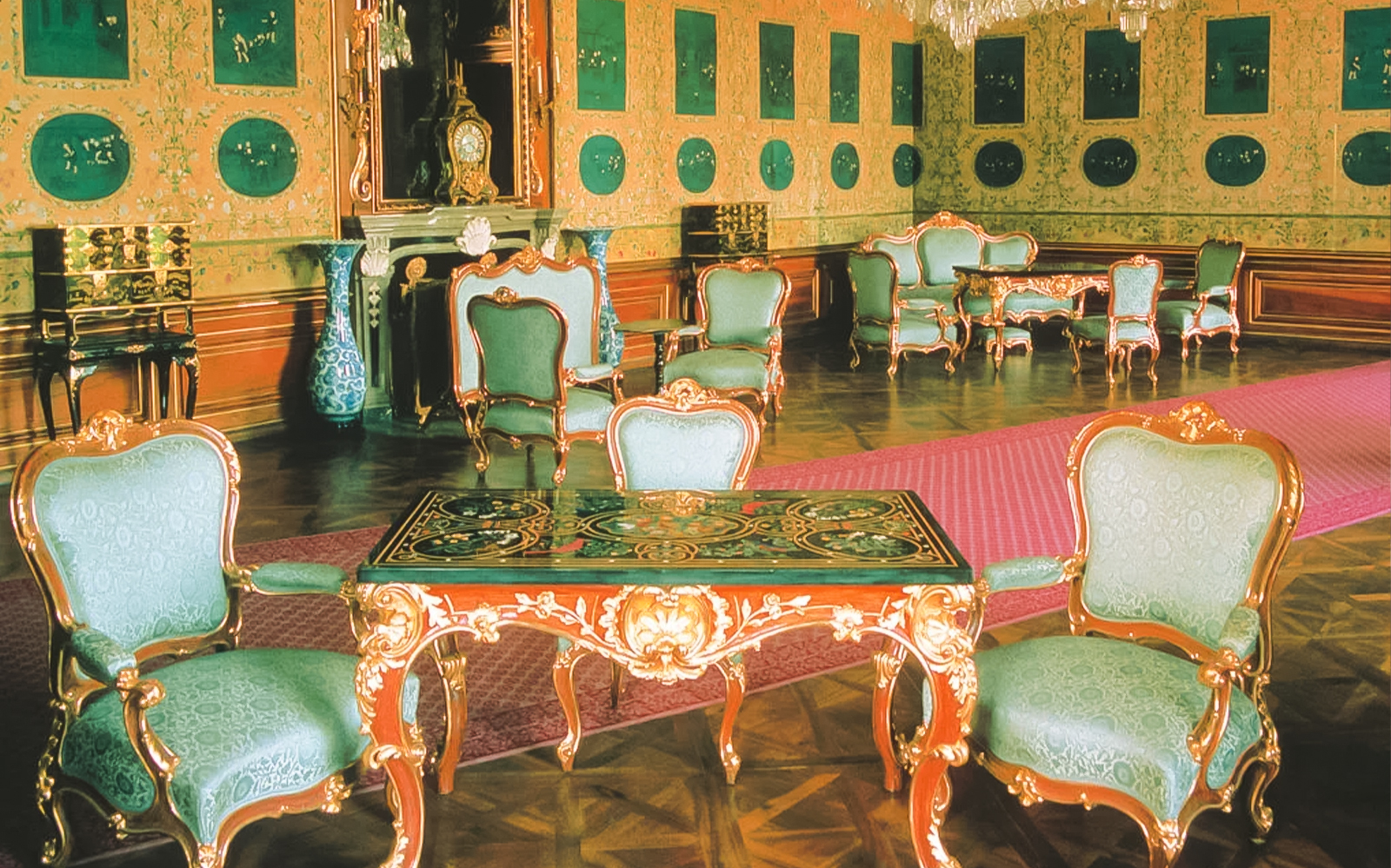Schonbrunn Palace interior with ornate furniture and decorative walls in Vienna, Austria.