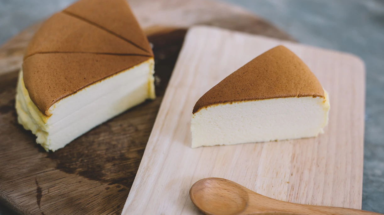 Japanese cheesecake slice on a wooden board, Singapore Christmas dessert.