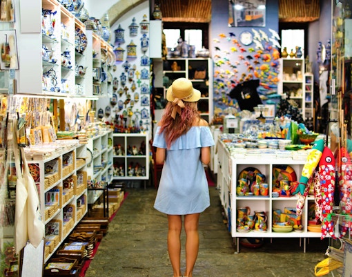 Shop filled with colorful souvenirs and ceramics.