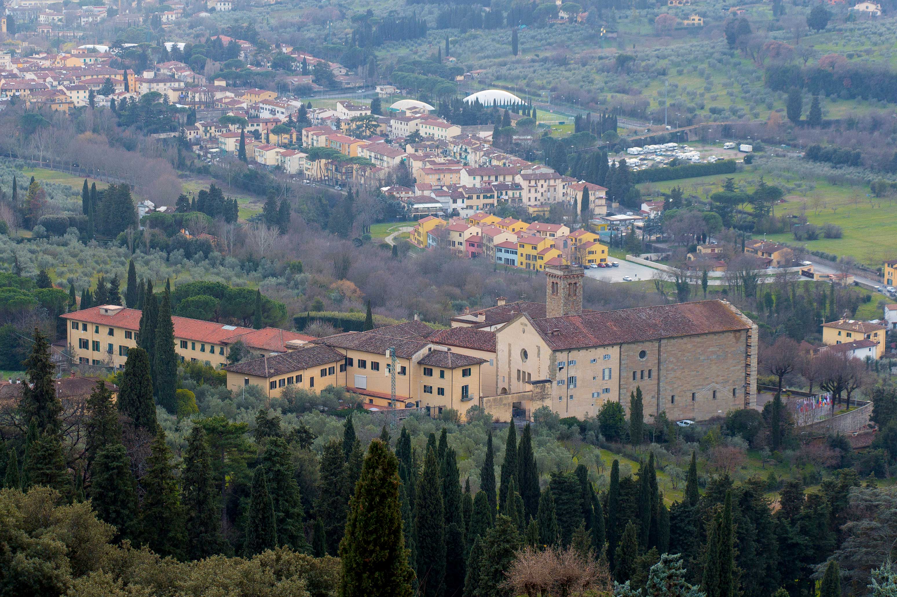 San Domenico Fiesole view with historic buildings and lush landscape near Florence.