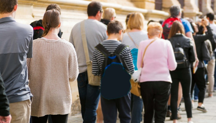 A long queue of people waiting to geth their tickets outside 9/11 Musuem