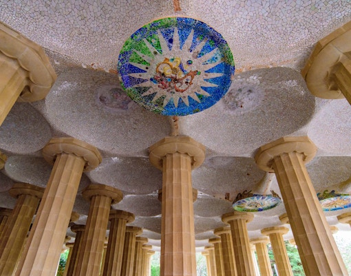 Hypostyle Room columns and mosaic ceiling in Park Güell, Barcelona.