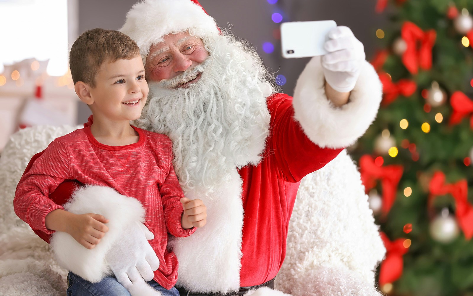 Santa taking a selfie with a child at Melbourne Myer Christmas Windows.