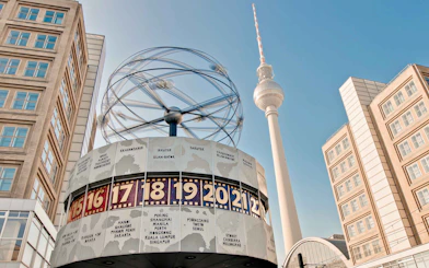 World clock and TV tower at Alexanderplatz, Berlin during Christmas season.