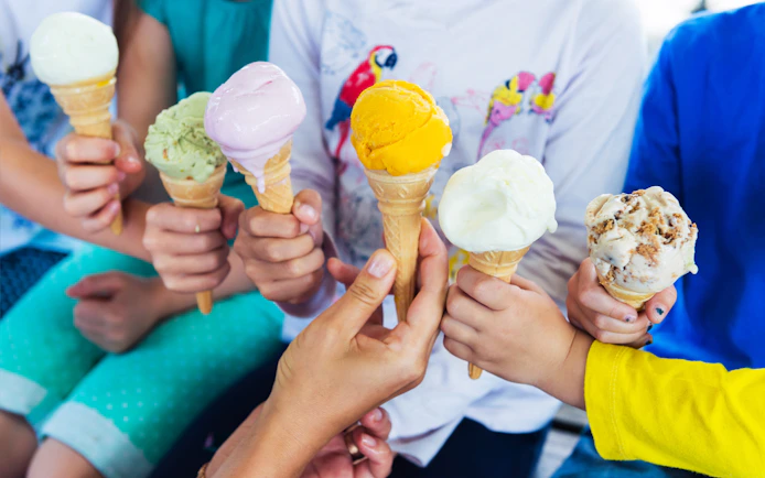 Children holding colorful ice cream cones at Universal Studios Japan.