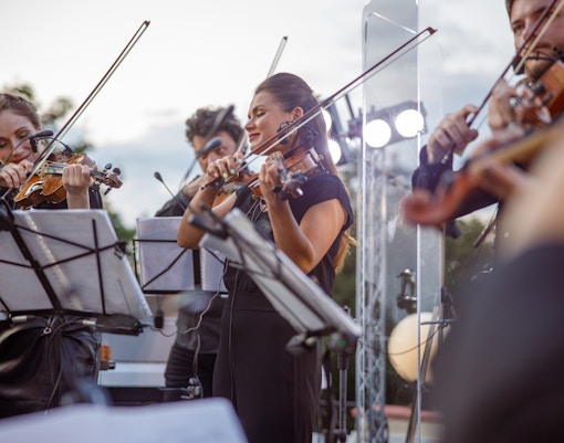 Orchestra performing classical music at a historic concert in Paris
