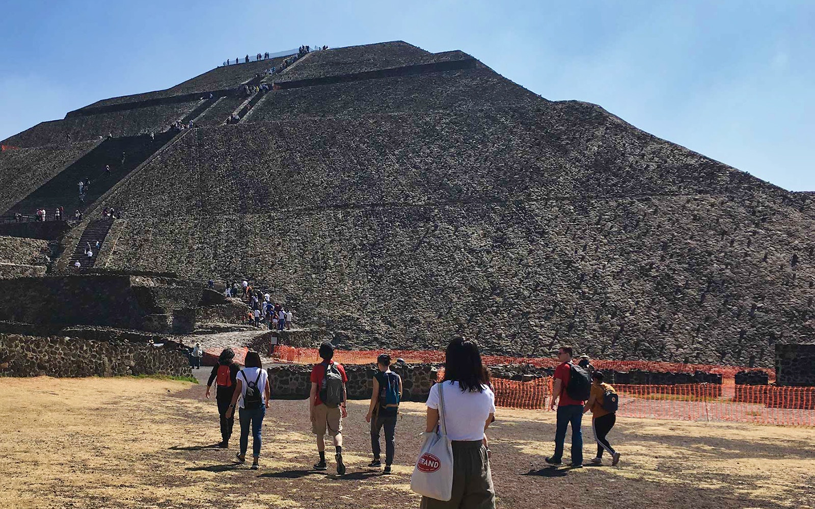 Visitors walking towards the Pyramid of the Sun in Teotihuacan, Mexico.