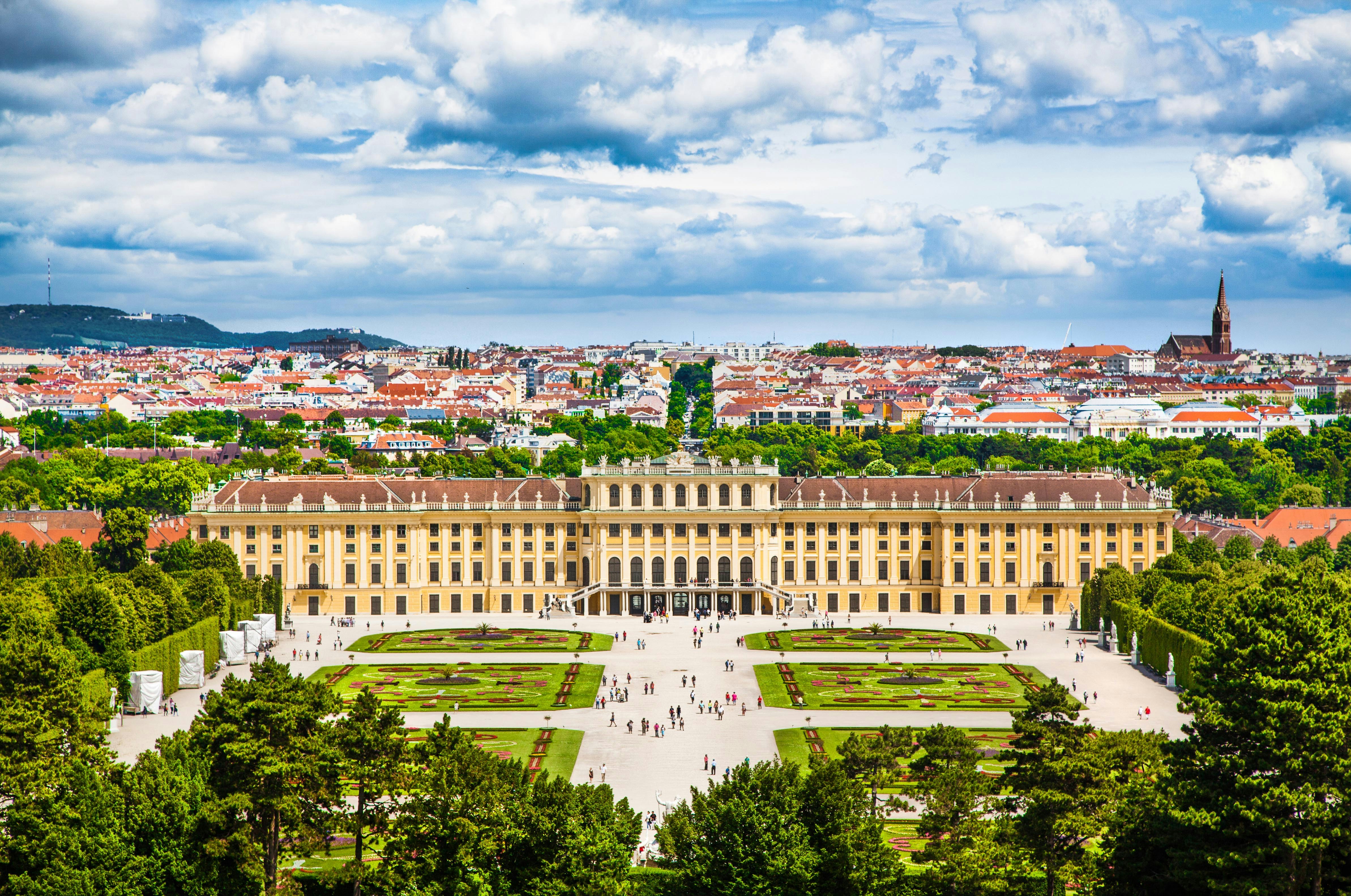 Tourists at Schonbrunn Palace and Gardens, Vienna, on Hop On Hop Off iCity Tour.