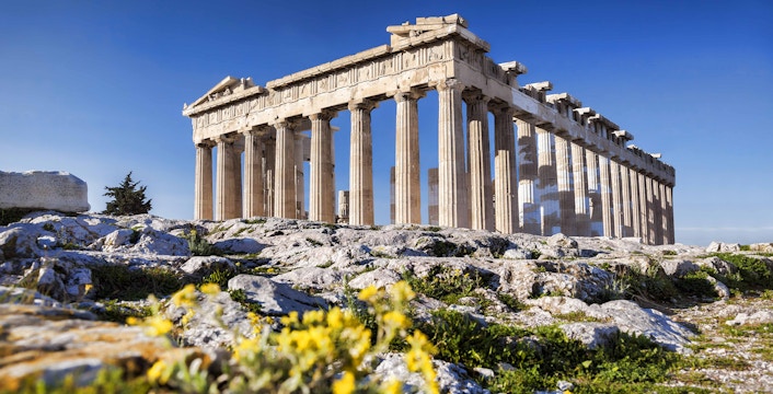 Acropolis Parthenon exterior with tourists in Athens, Greece.