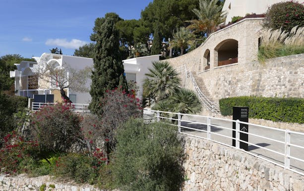 Fundació Joan Miró exterior with stone walls and lush greenery in Barcelona.