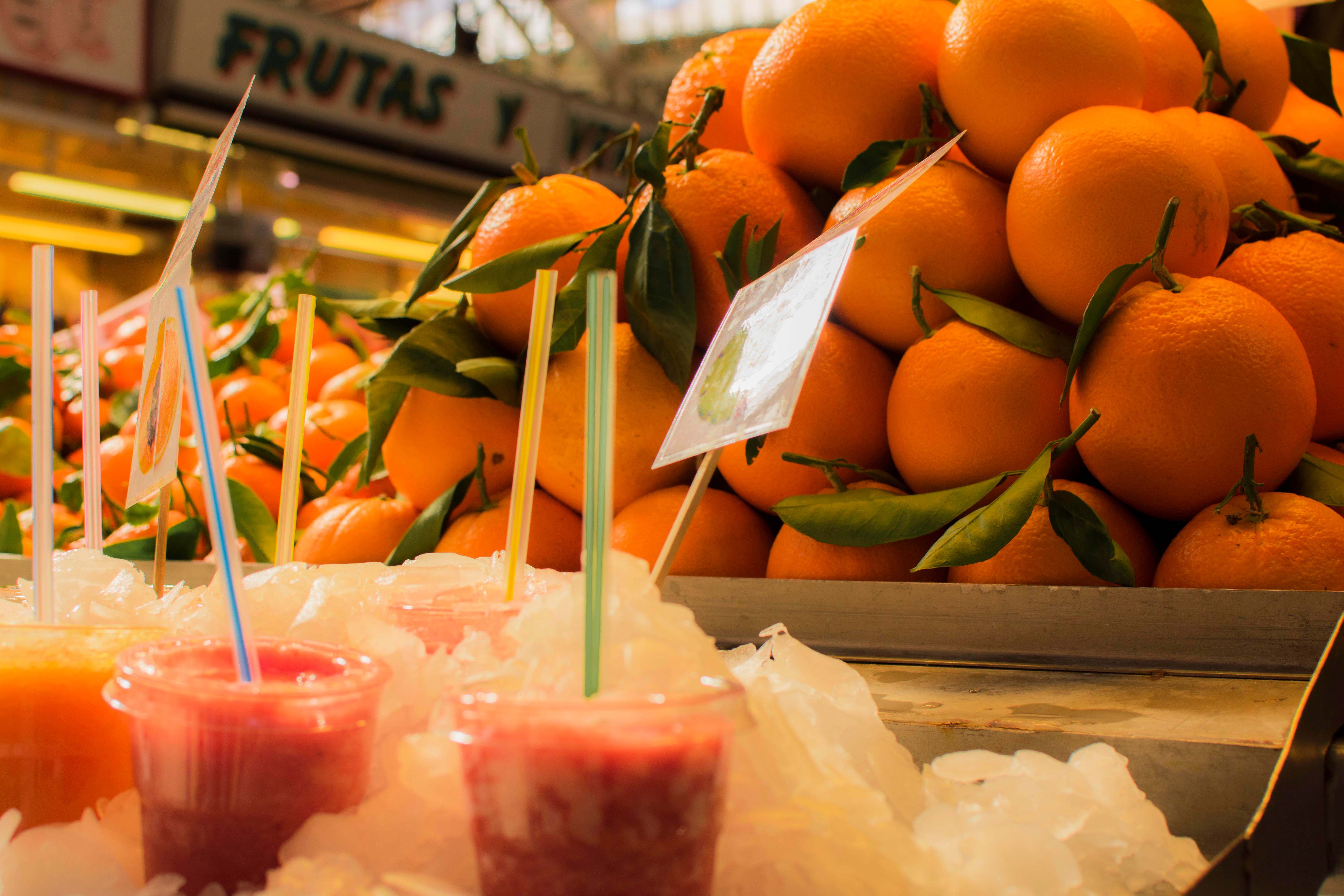 Oranges and fresh juice at a market stall in Barcelona.