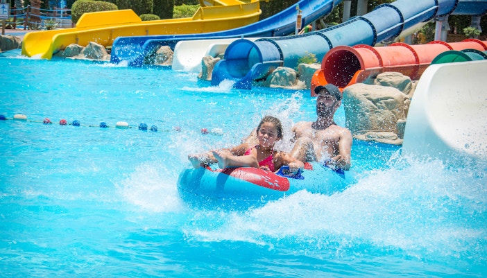Children playing in the wave pool at Aquaboulevard water park, Paris.