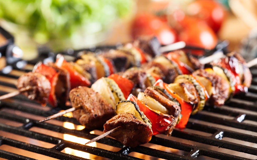 Grilled kebabs with vegetables on a barbecue in Dubai, September.