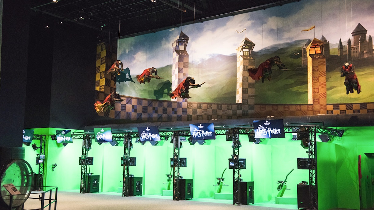 Quidditch set at Harry Potter Studio, featuring broomsticks and golden snitch.