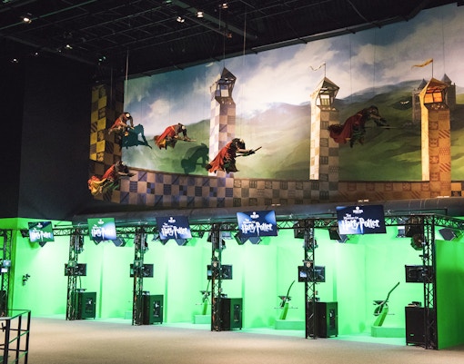 Quidditch set at Harry Potter Studio, featuring broomsticks and golden snitch.