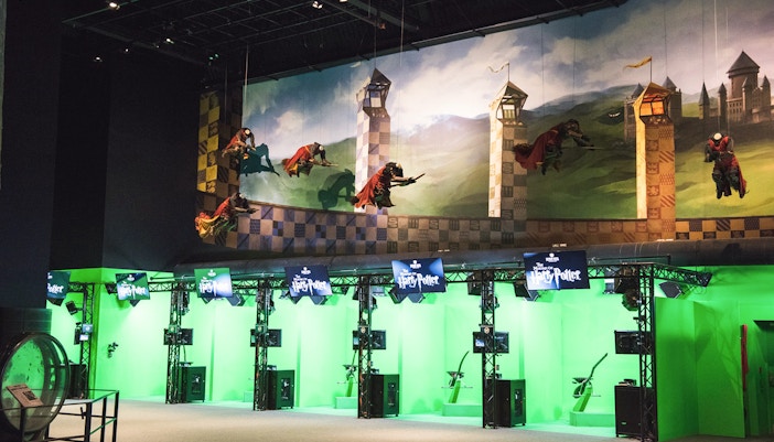 Quidditch set at Harry Potter Studio, featuring broomsticks and golden snitch.