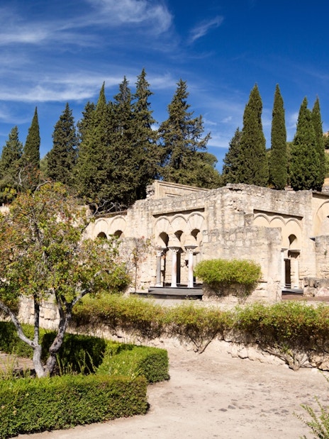 Medina Azahara ruins with cypress trees in High Garden, Cordoba.
