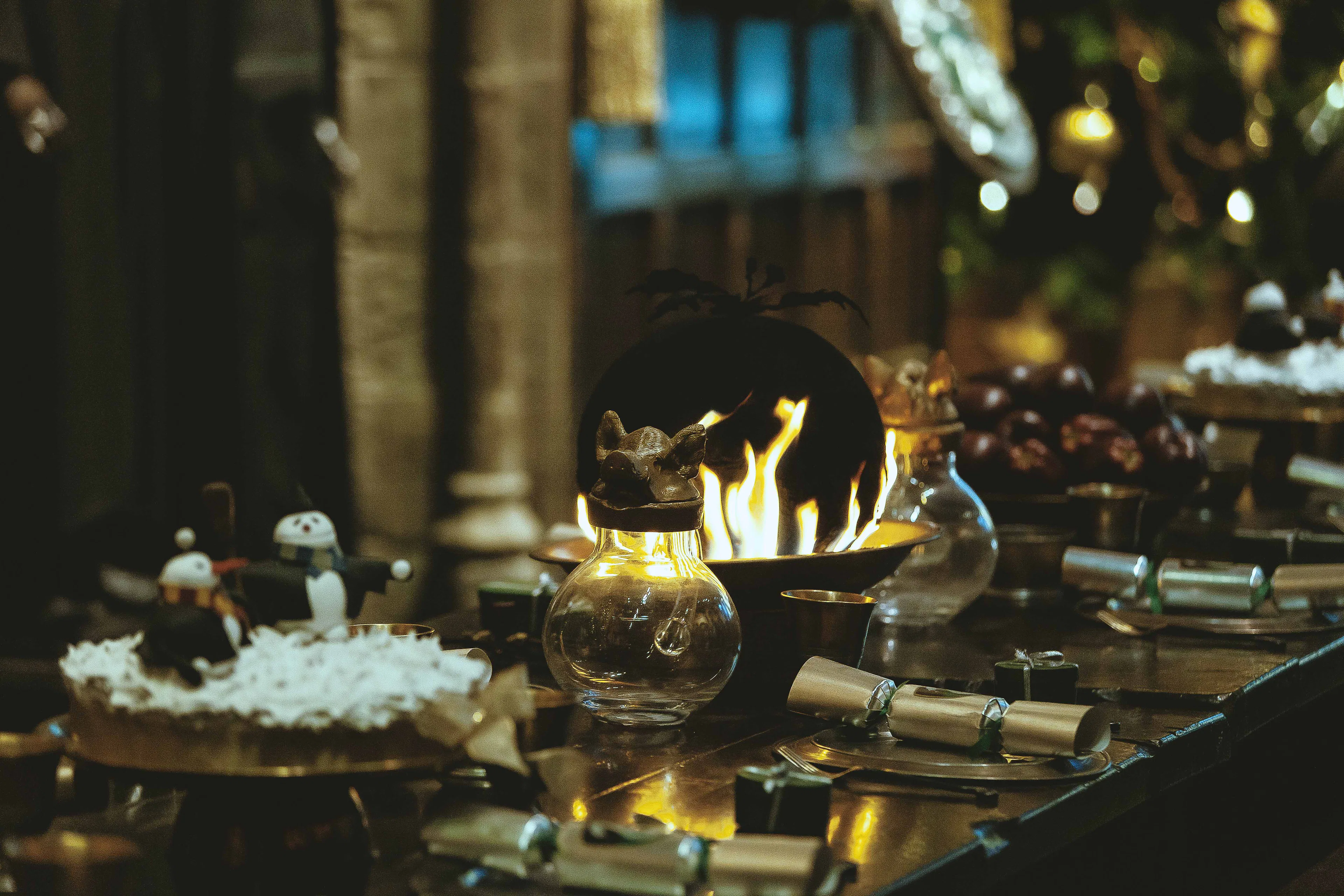 Dining table set with magical props at Harry Potter Making Of tour, London.