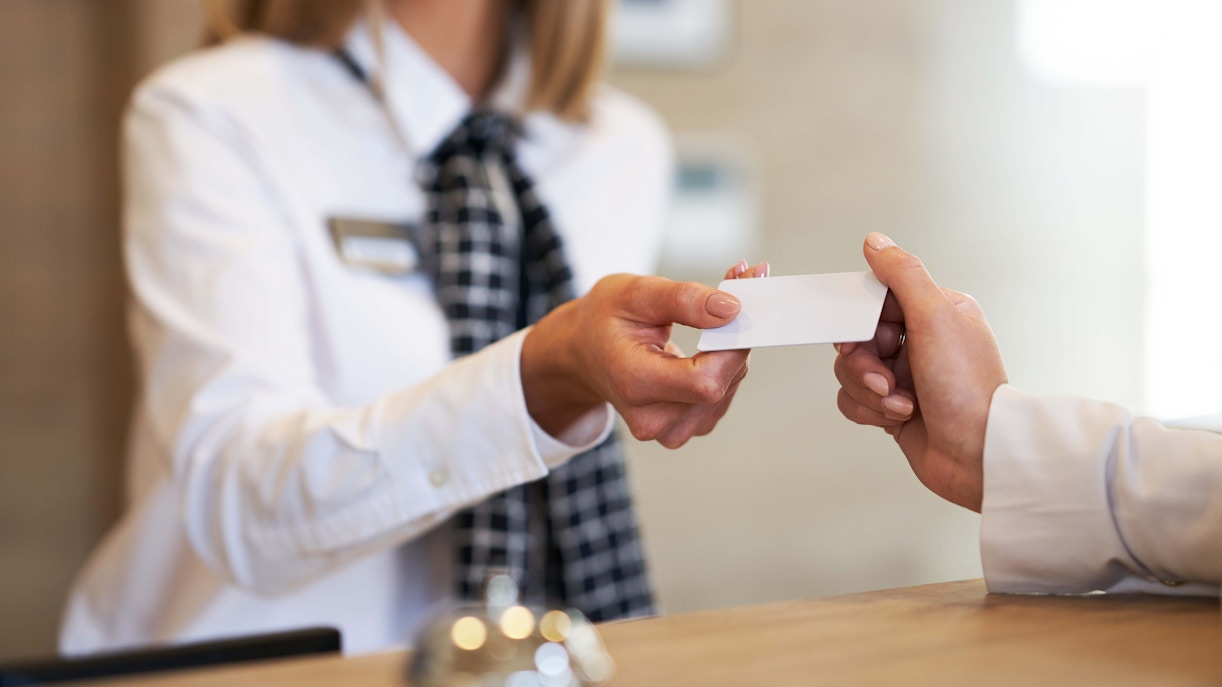 Hotel staff handing over keys
