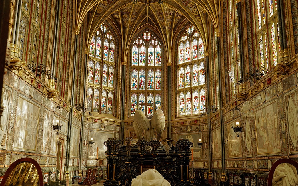 Stained glass windows and ornate Gothic interior of St George's Chapel, Windsor Castle, England.