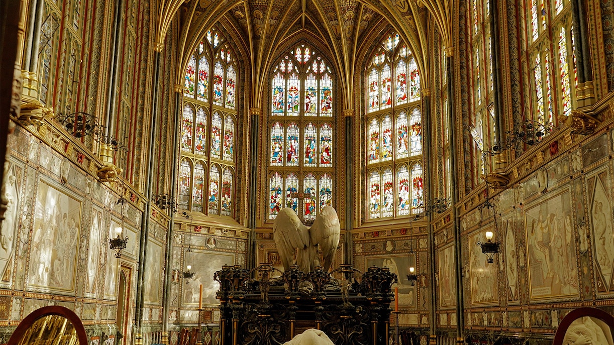 Stained glass windows and ornate Gothic interior of St George's Chapel, Windsor Castle, England.