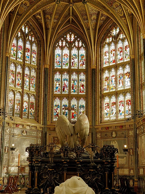 Stained glass windows and ornate Gothic interior of St George's Chapel, Windsor Castle, England.