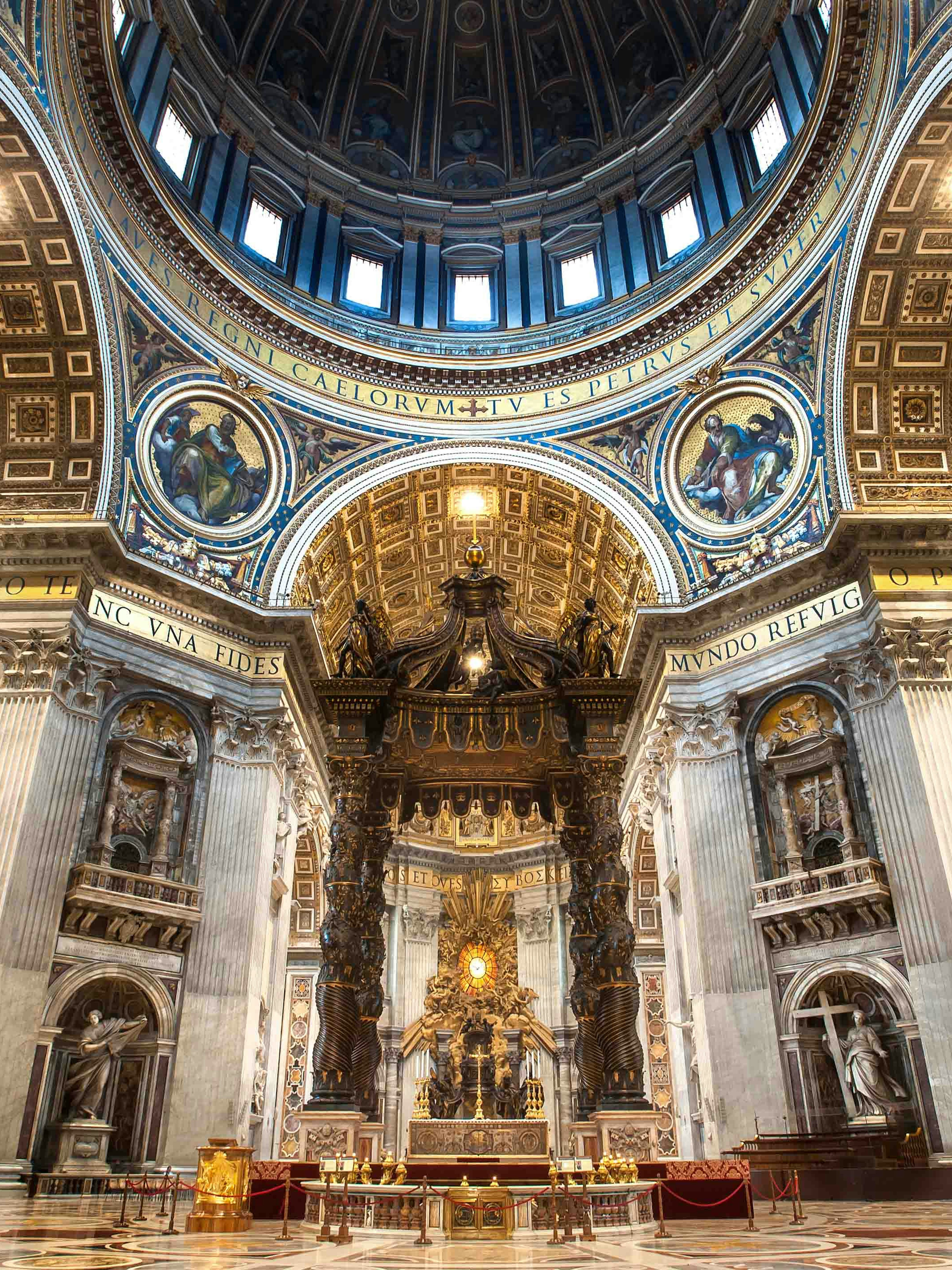 St. Peter's Basilica interior with ornate dome and altar in Vatican City.